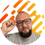 Portrait of a smiling web developer with a colorful graphic background